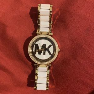 Gold and white Micheal kors watch
